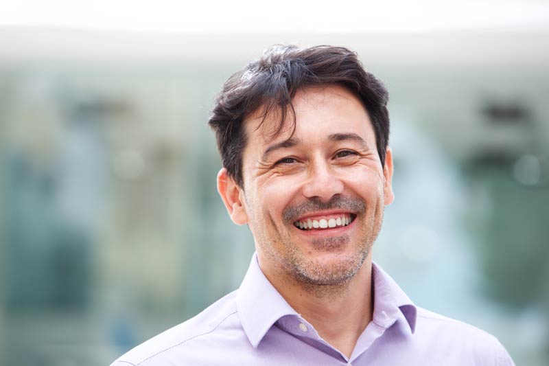 close up relaxed mature man smiling outdoors