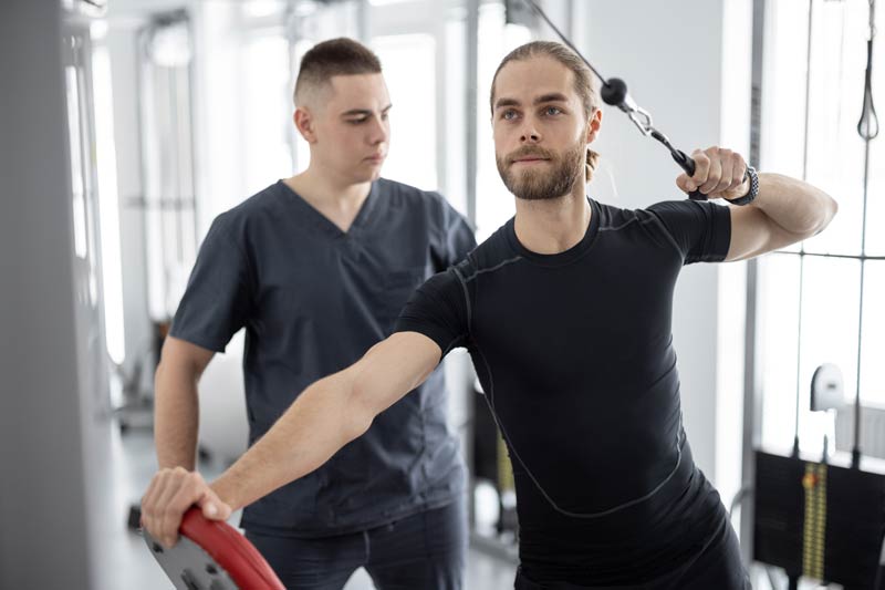 man doing exercises on decompression simulators