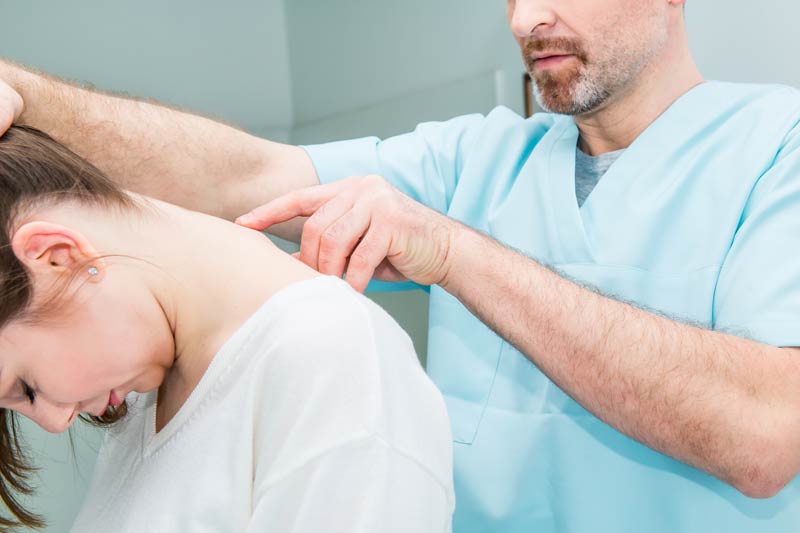 neurologist doctor examines cervical vertebrae