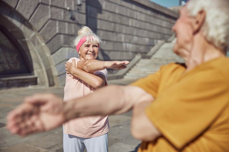 two people performing a cross body shoulder